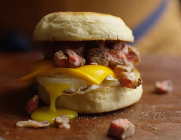 Diced ribeye on an English muffin with egg and cheese