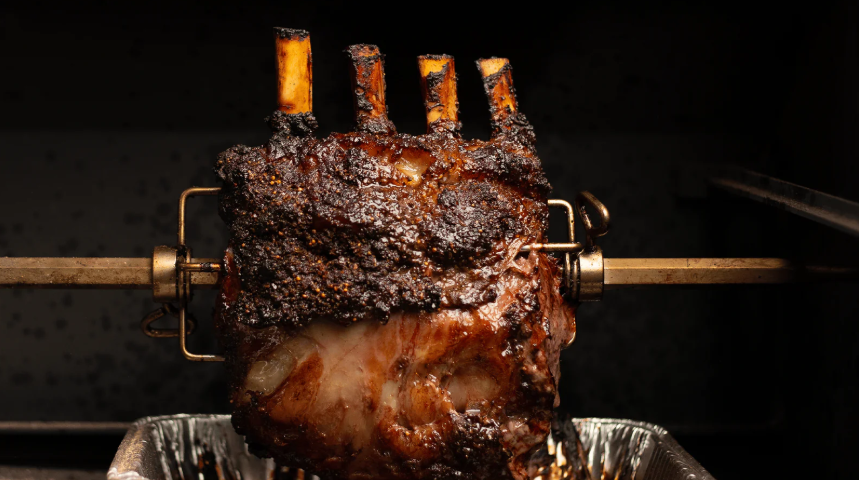 4 Bone Ribeye (or Prime Rib) on a rotisserie spit