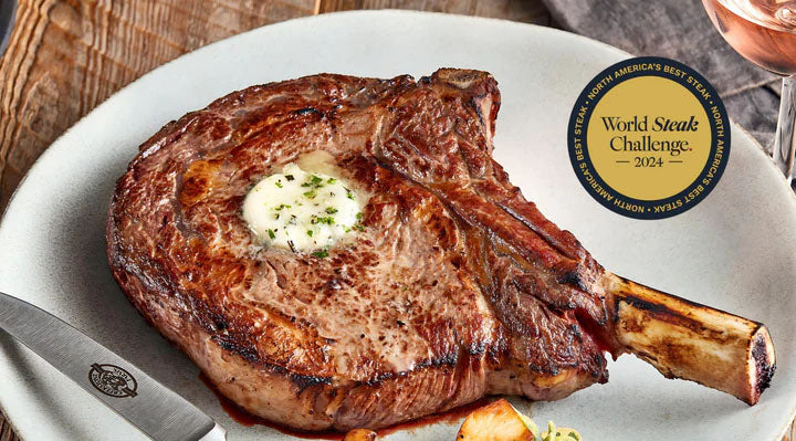 Grilled steak on a plate with a 'World Steak Challenge' label, knife on the side.