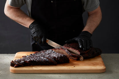 Butcher Slicing Meat